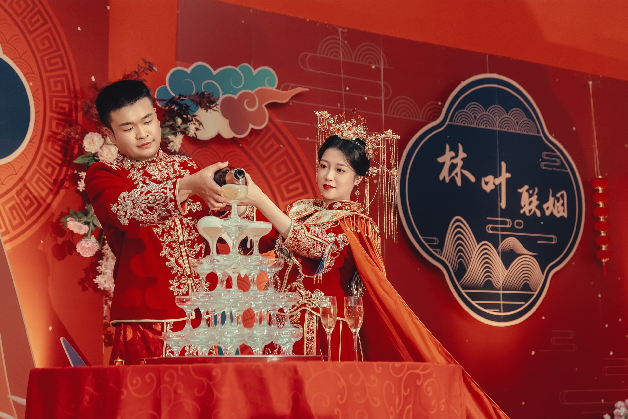 Couple in matching red wedding robes pouring the champagne tower — Orchid Photo, GTA Chinese wedding