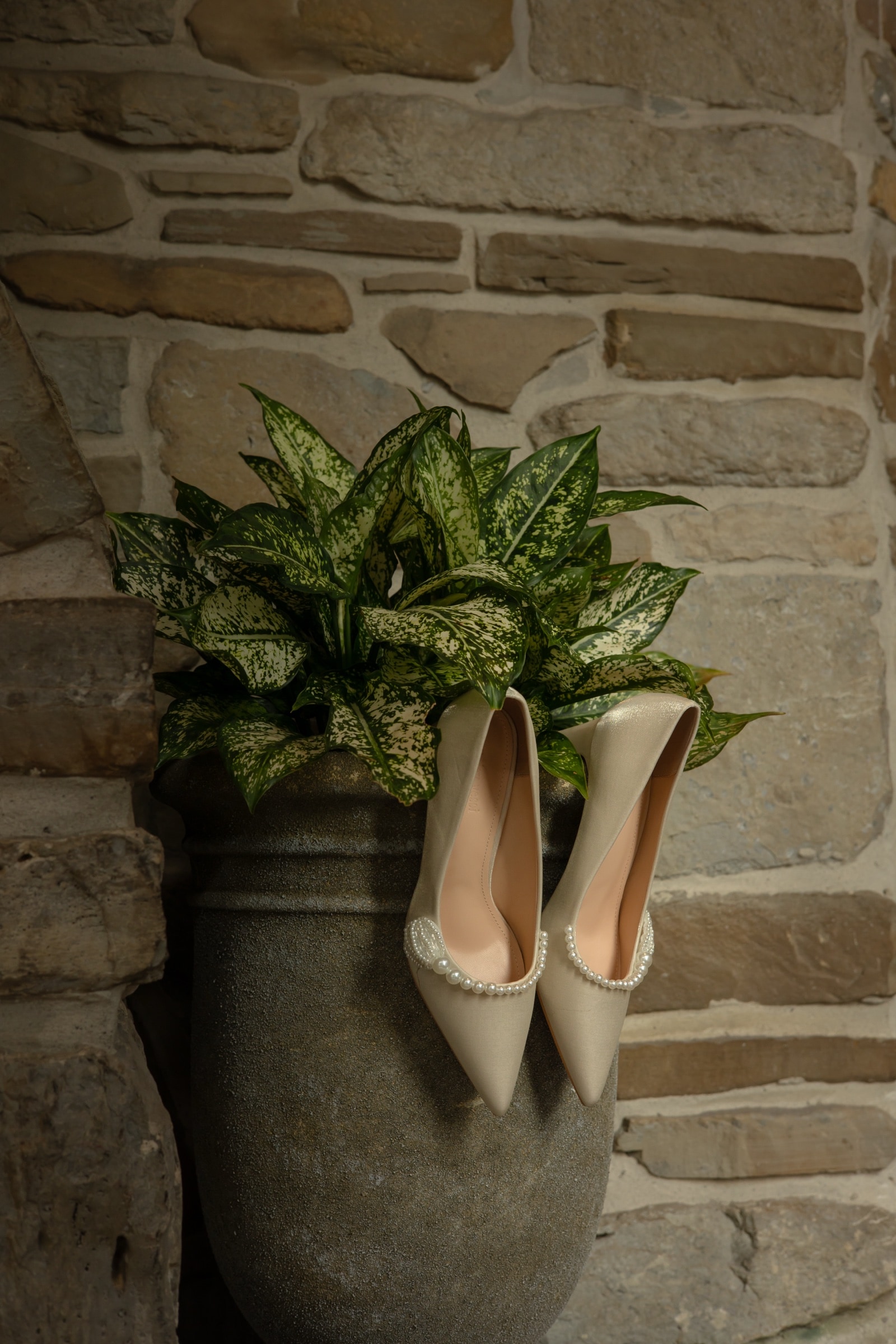 Wedding reception place setting with a menu card and greenery