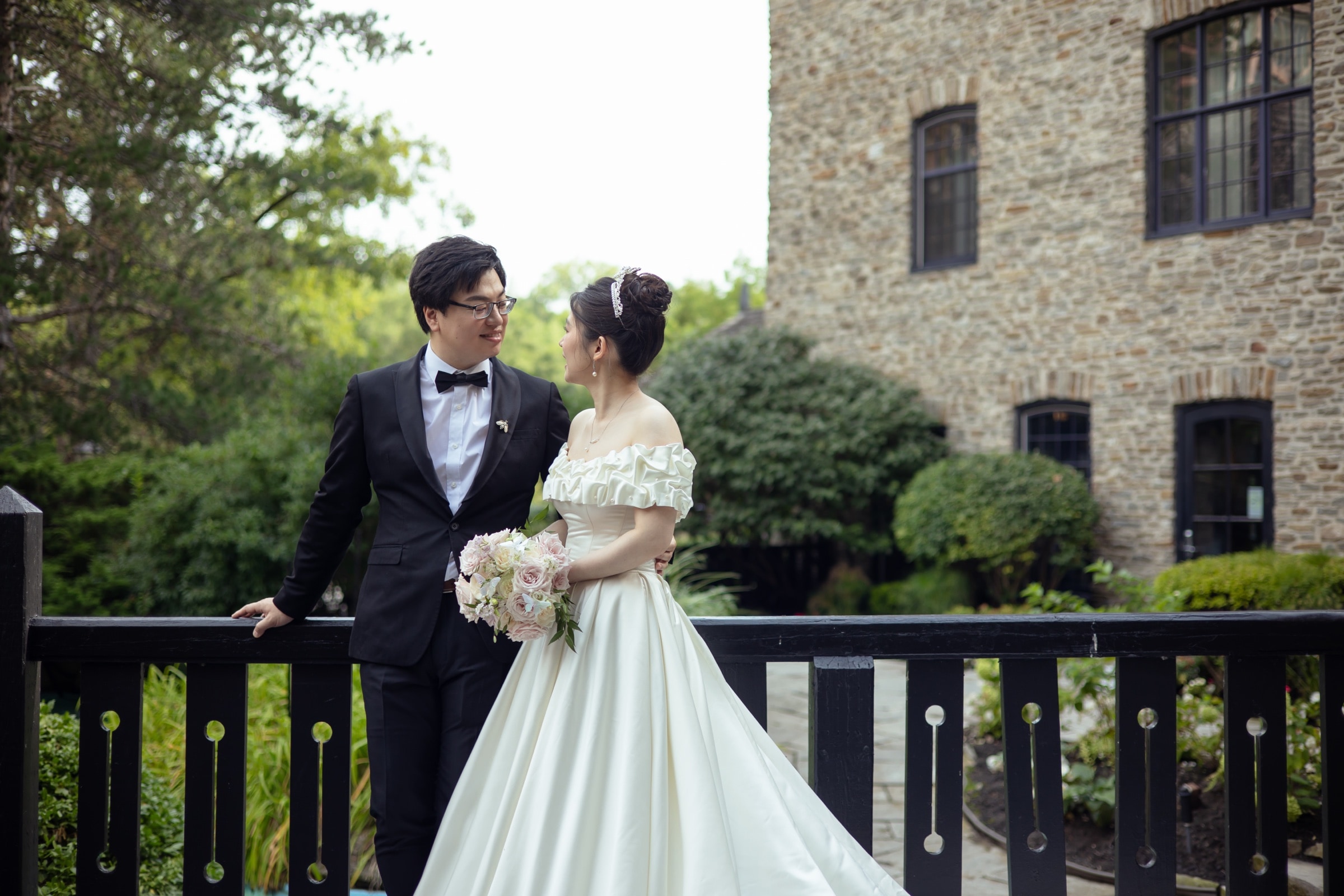 Bridal portrait beside the stone wall at Old Mill Toronto