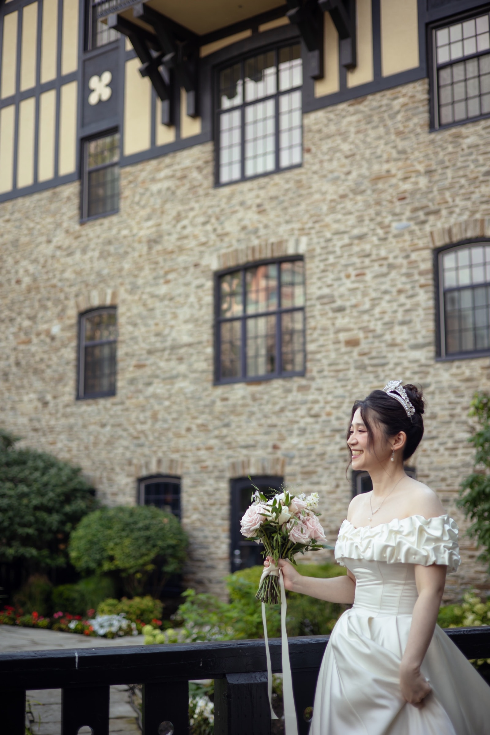 Bridal portrait before the Tudor half-timbered façade of Old Mill Toronto