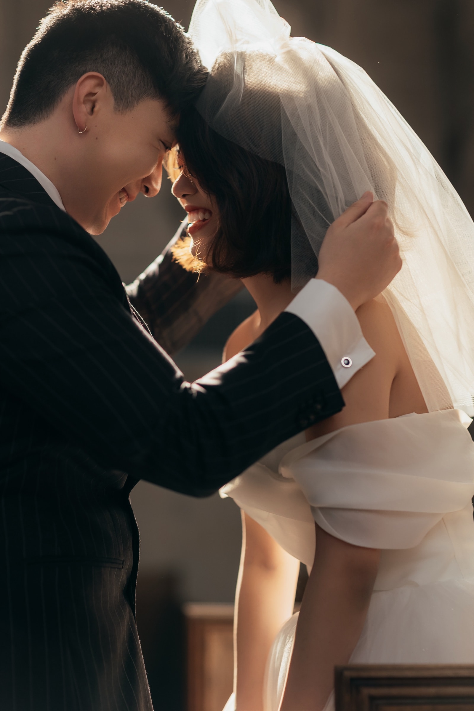 A candid, unposed laugh between the couple