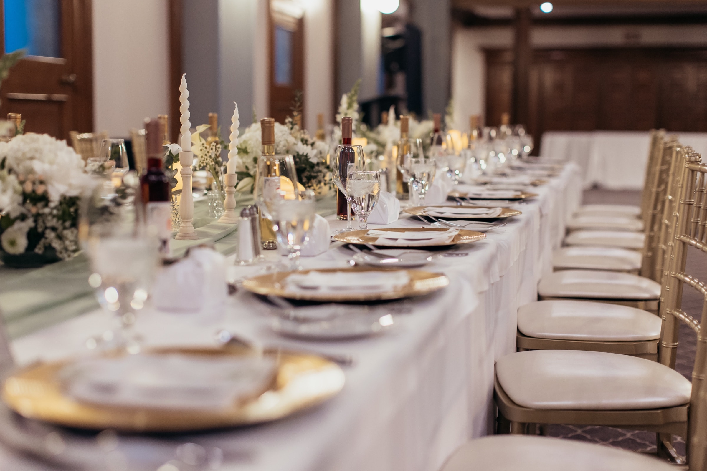 The panelled reception hall set for dinner