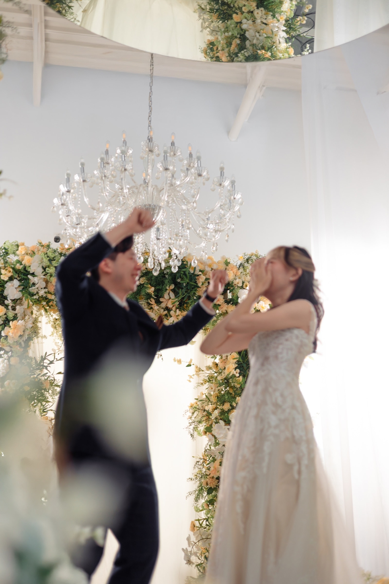 A celebratory moment under the chandelier