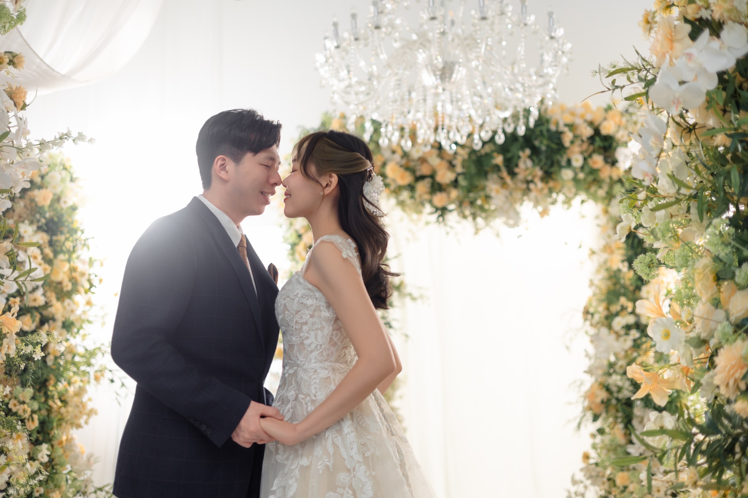 The first kiss at the floral arch