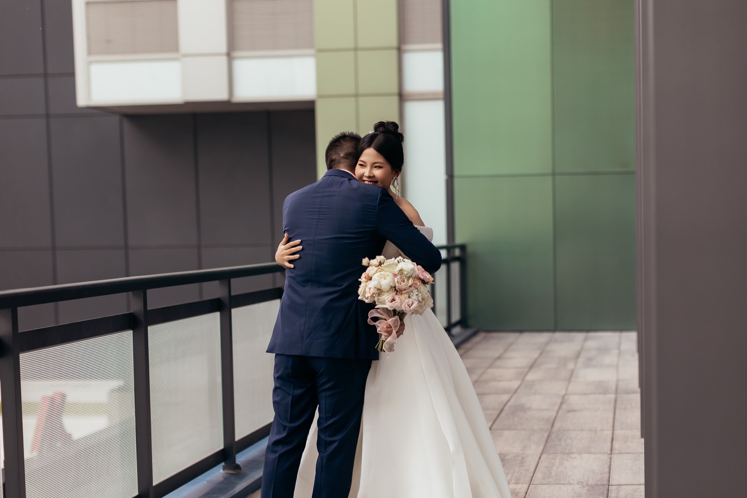 The couple in white, modern setting