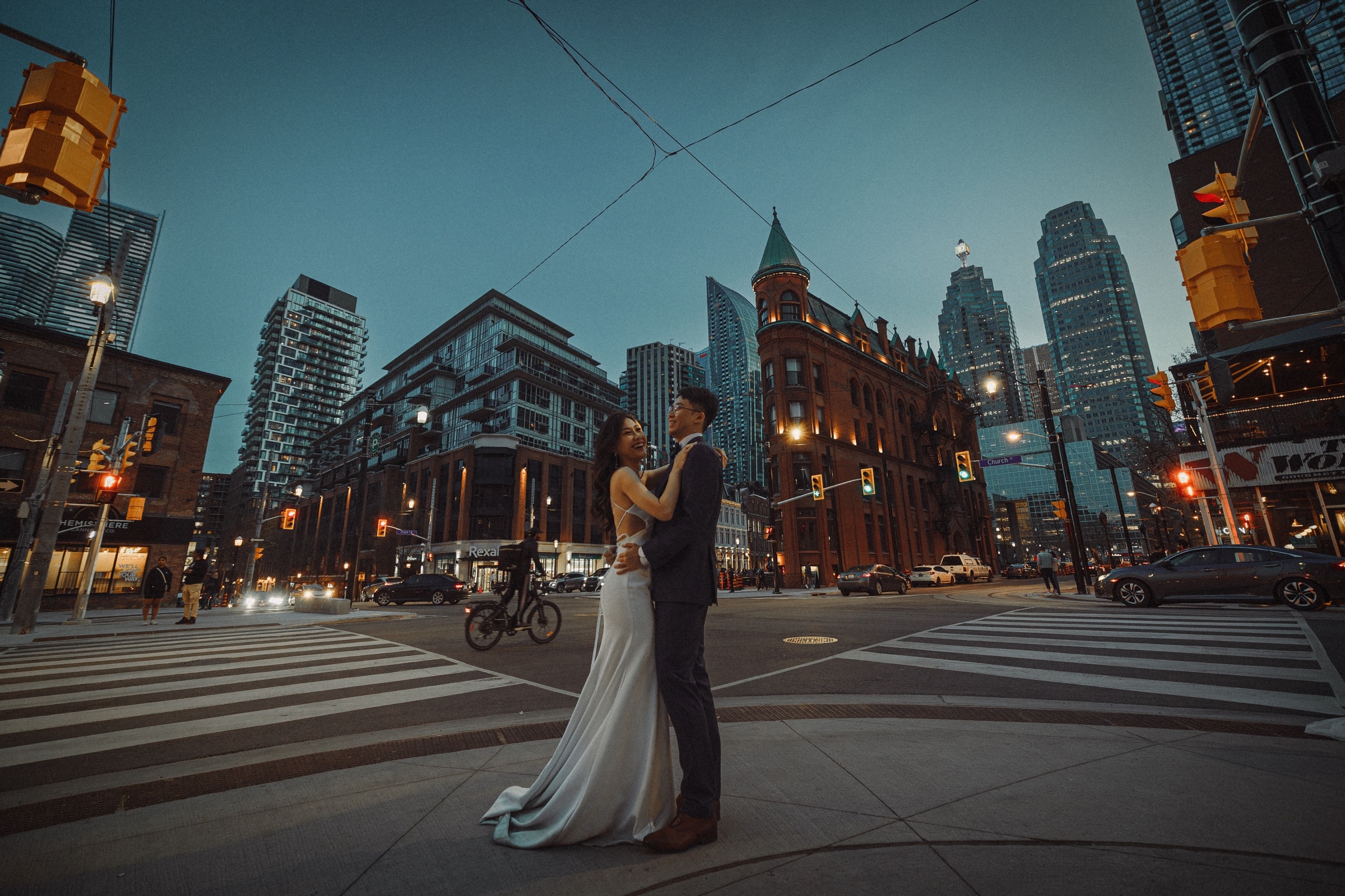 The couple at a downtown Toronto street corner at dusk
