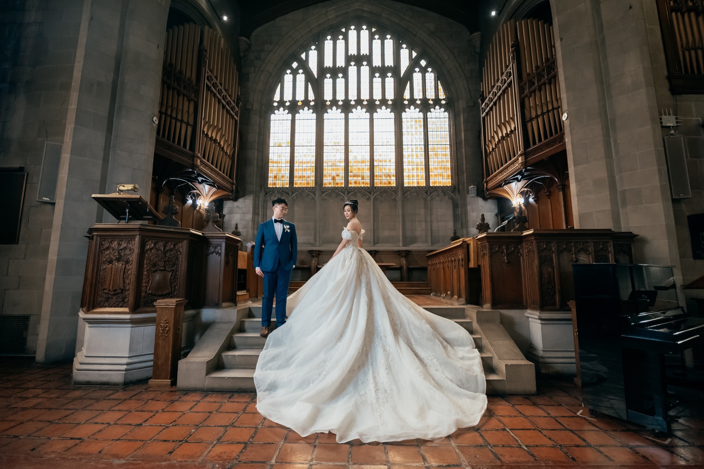 The bride's gown against the Gothic chapel windows at Knox College