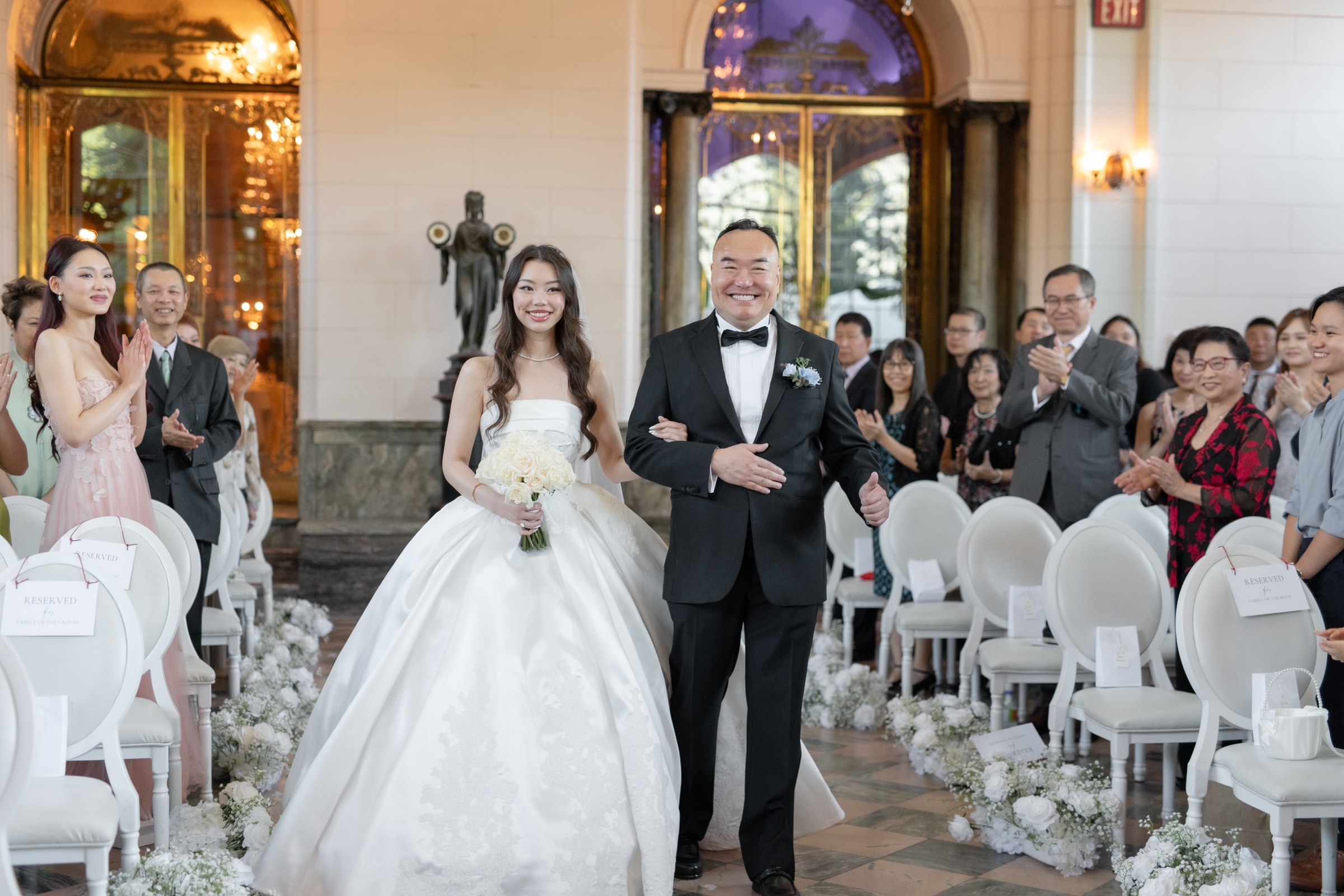 The bride walking in to applause on a steady arm