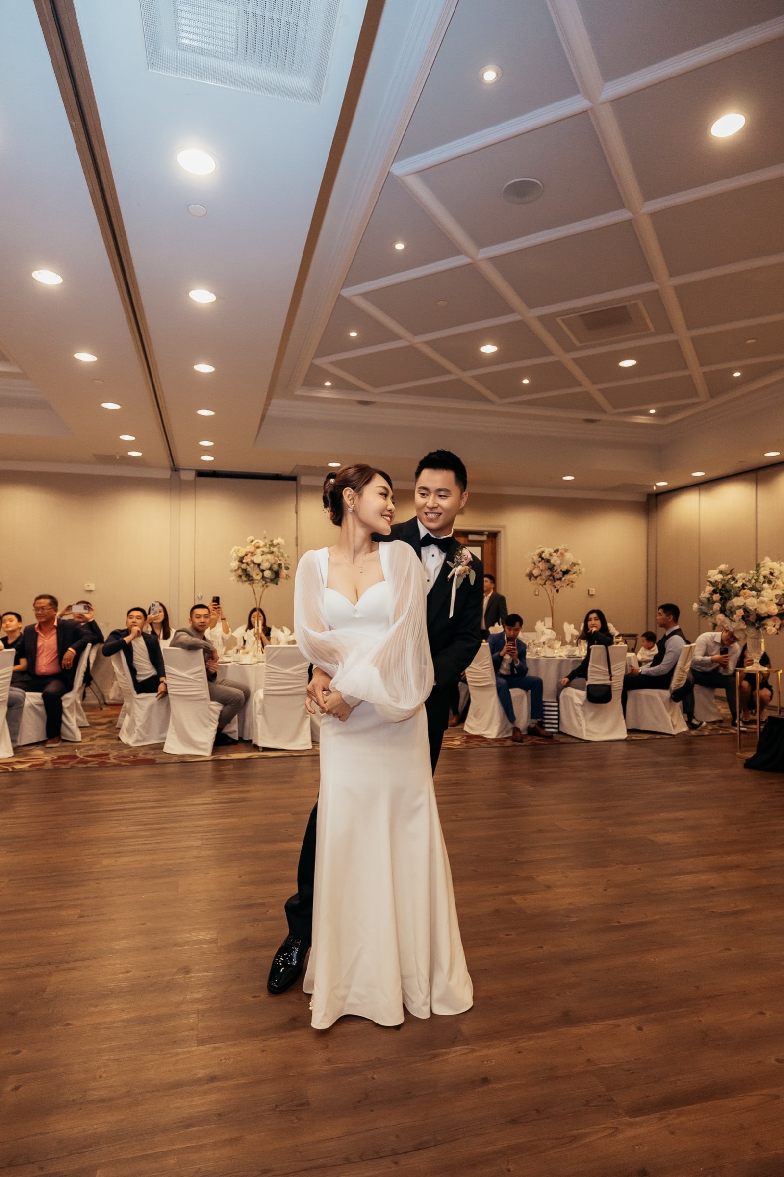 The bride and groom in the reception hall