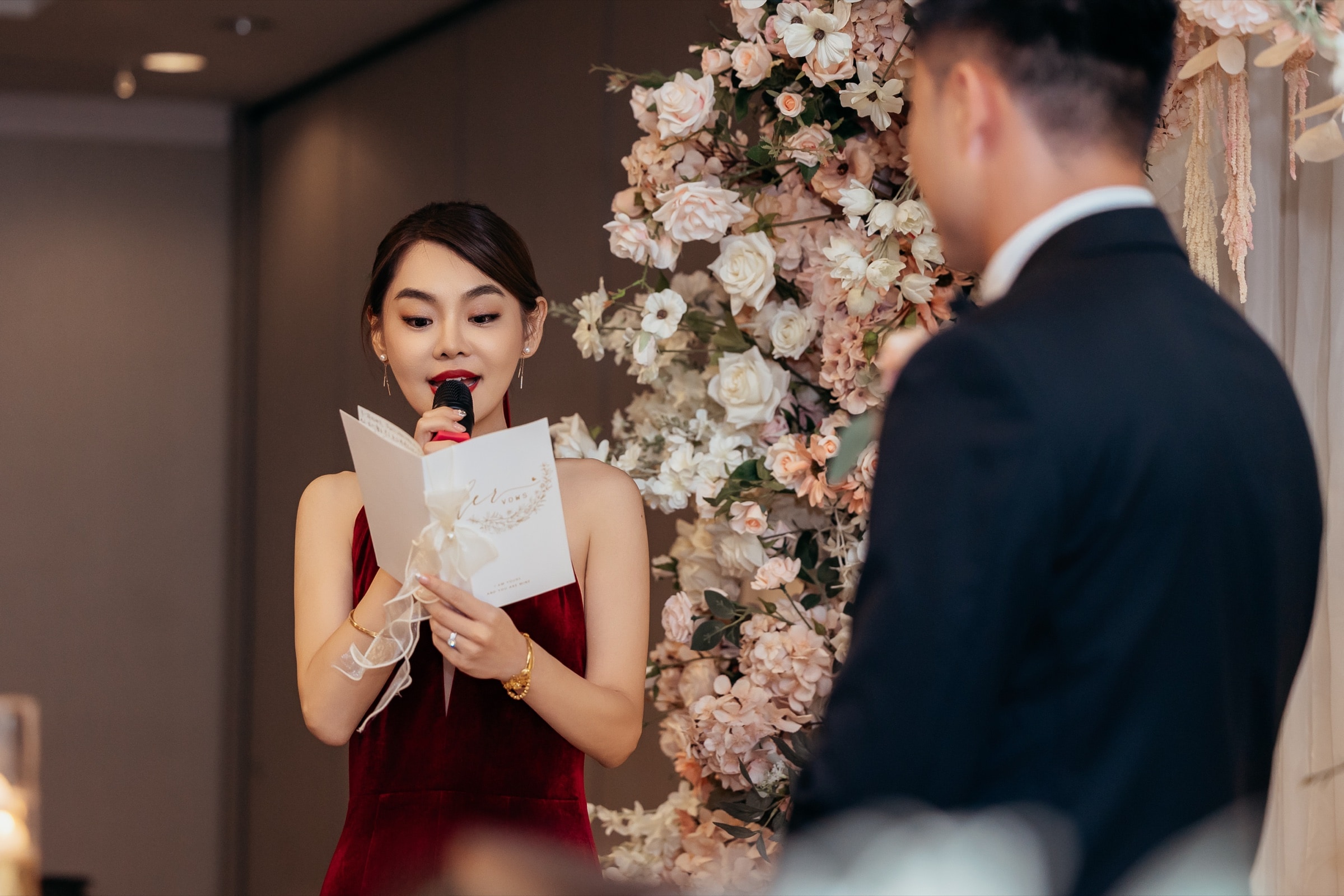 The bride in a red dress at the reception
