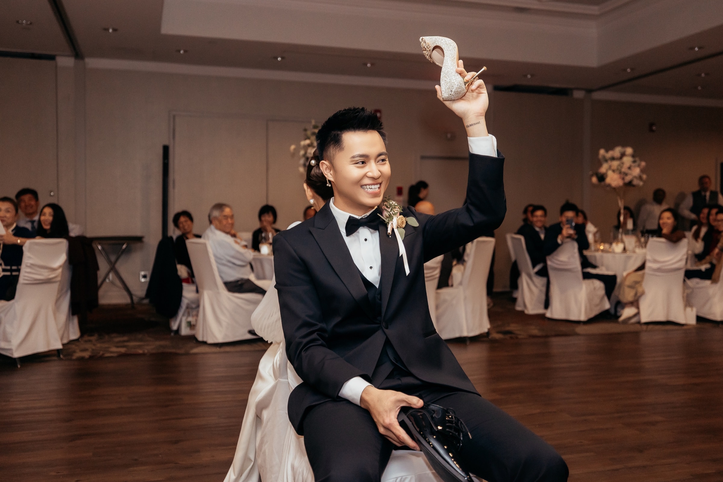 The groom seated at the celebration