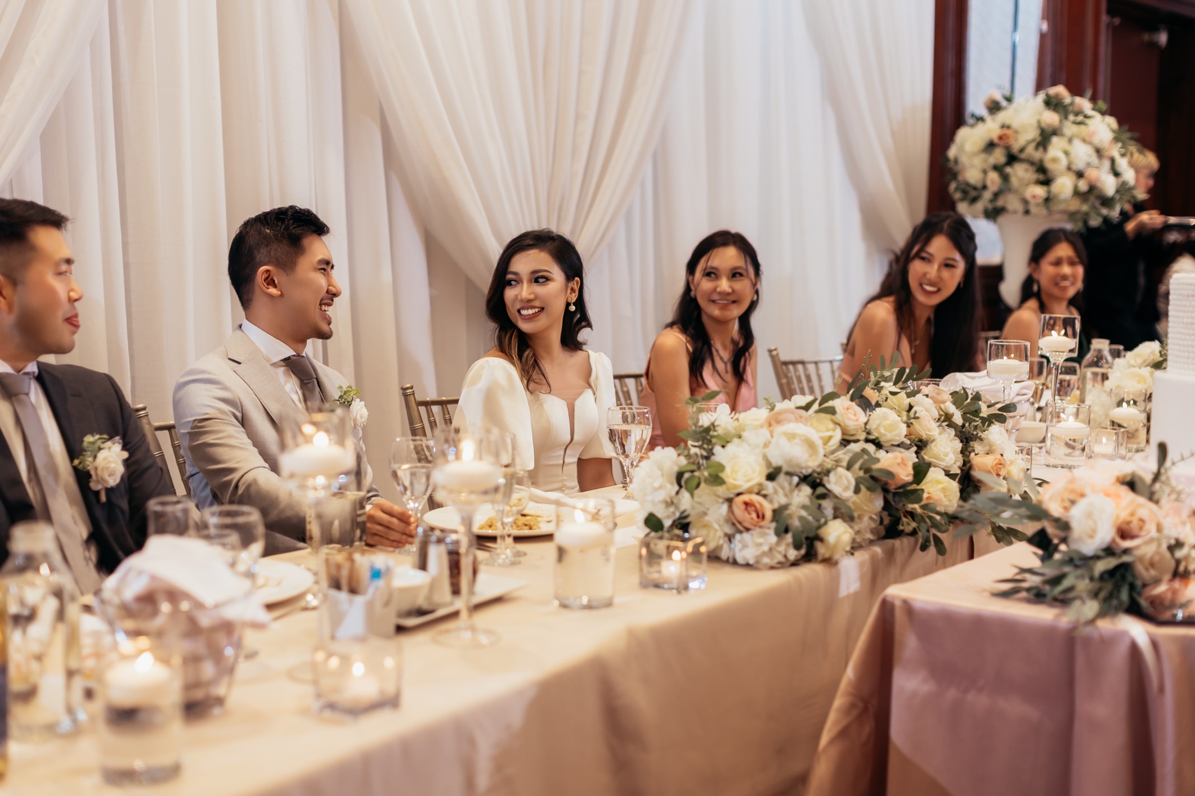 The reception tables with florals