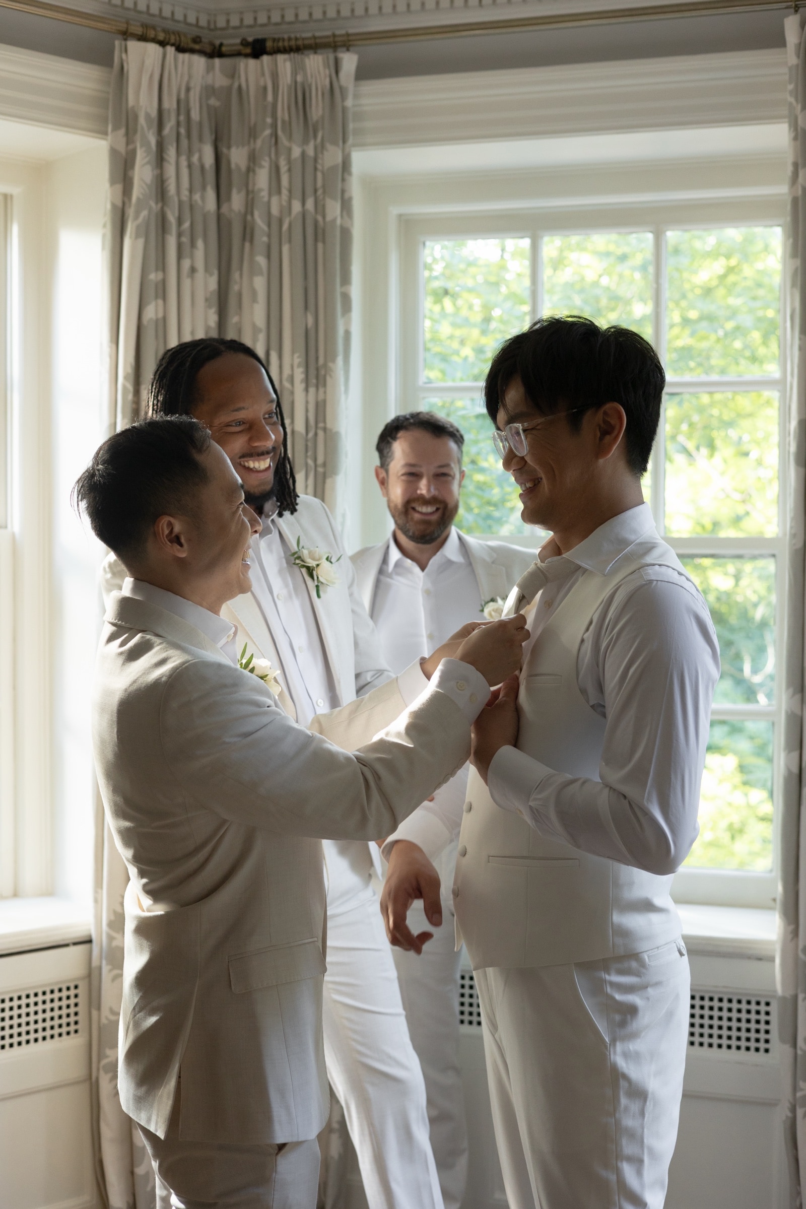 The groom getting ready with his groomsmen