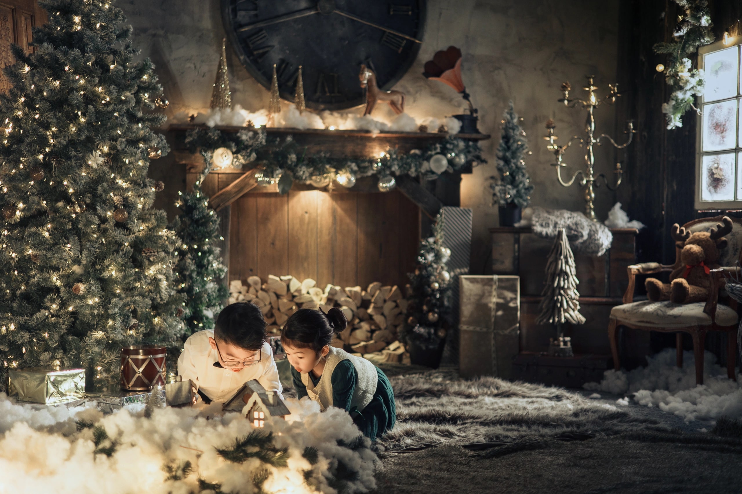 Andersen’s Fairy — two children watching the snowy cabin by the fireplace