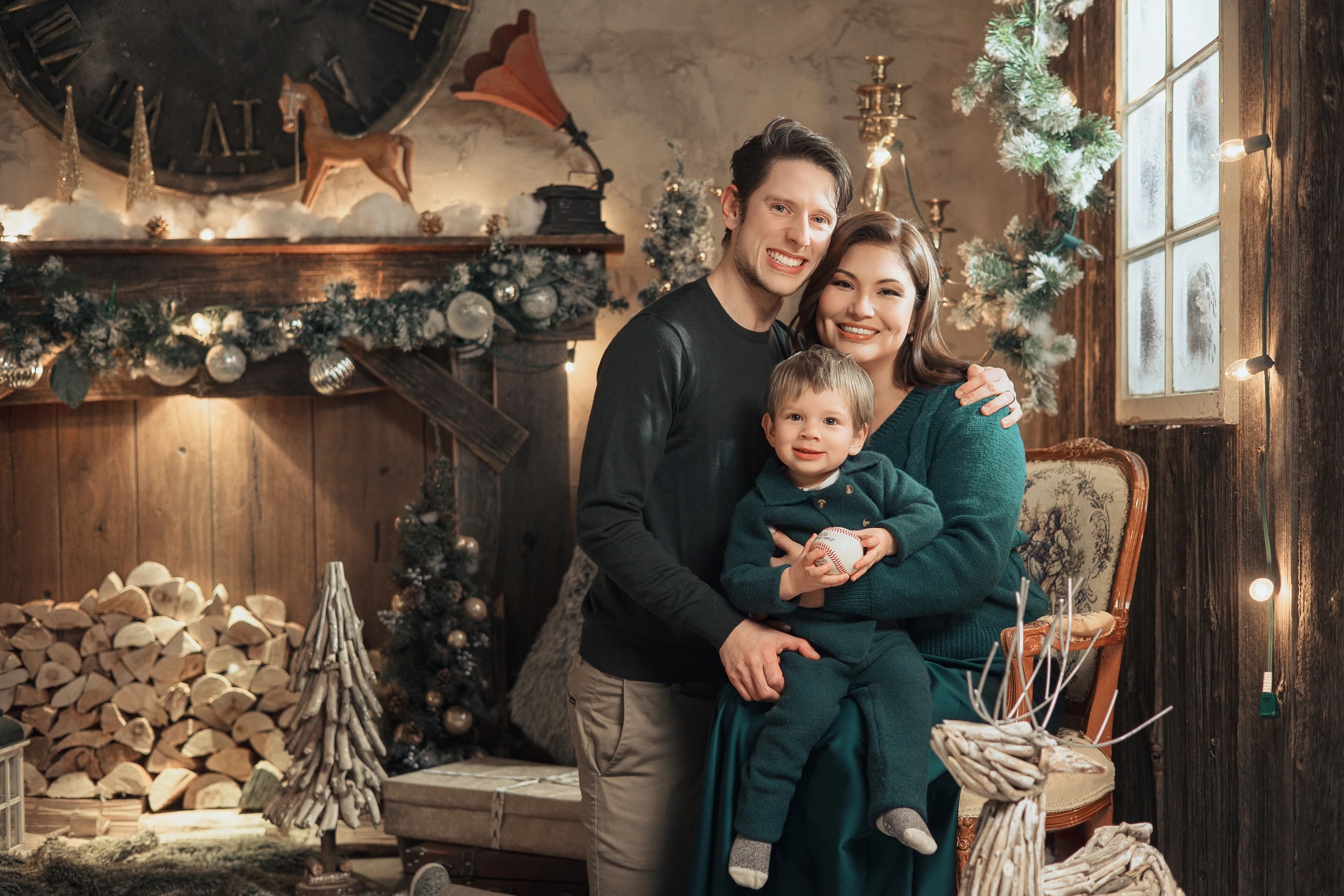 Andersen’s Fairy — parents and a toddler by the fireplace
