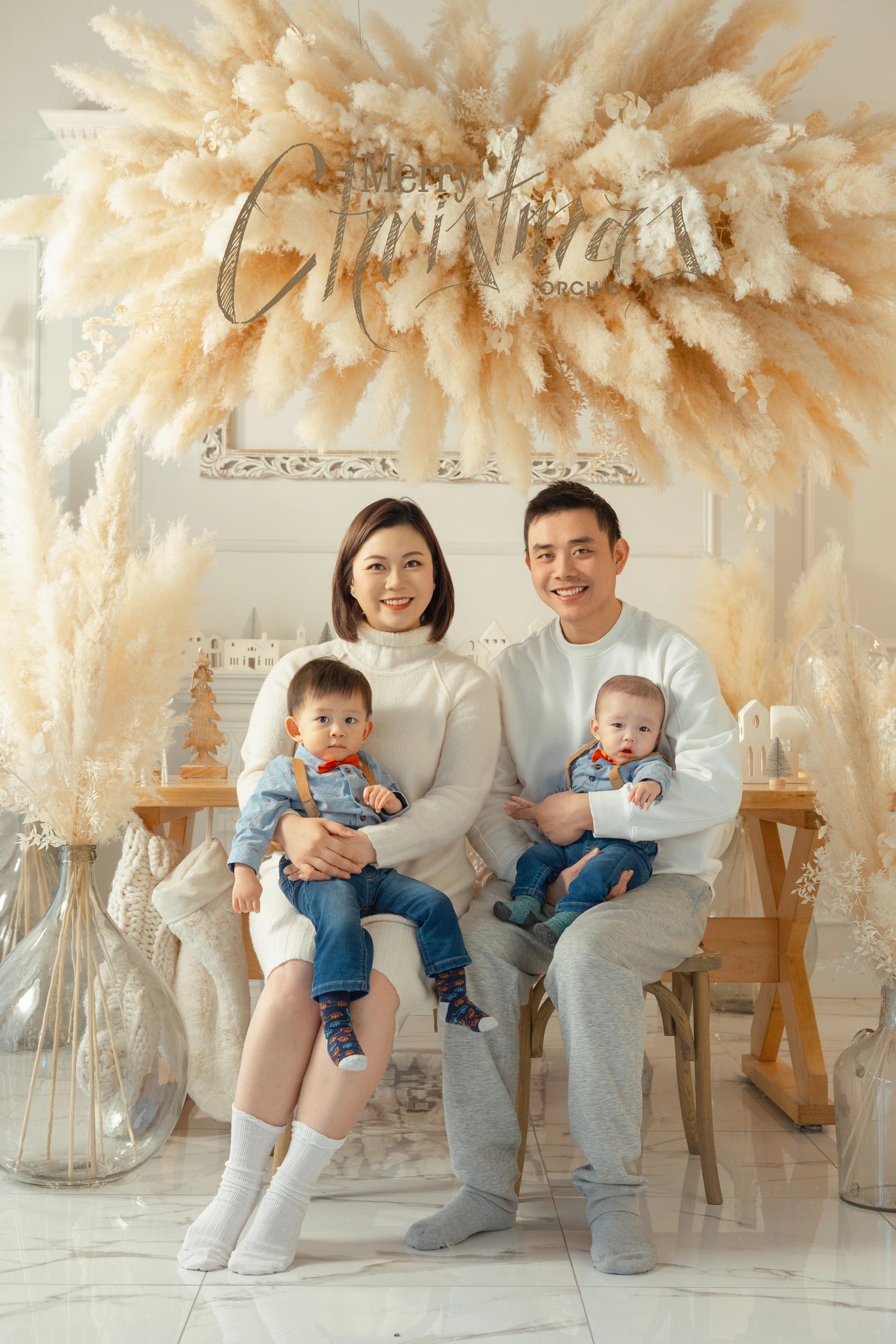 Winter Whispers — a family under the pampas wreath